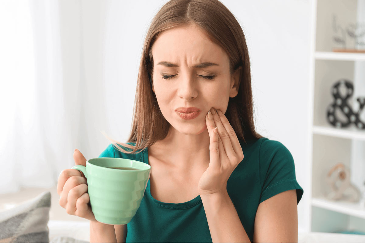 A Woman Suffering from Sensitive Teeth in Frenchs Forest